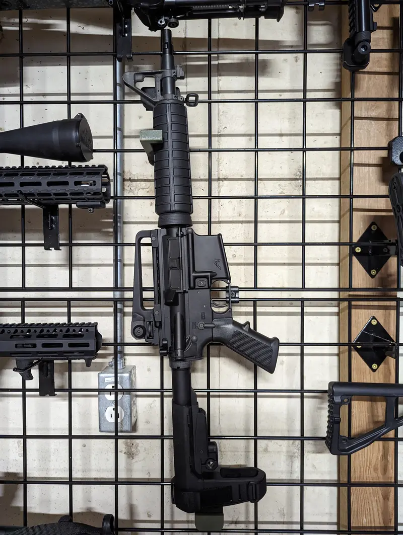 Universal Vertical Firearm Gridwall Mount – Adjustable Gun Holder 1